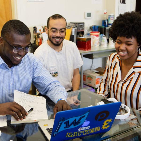 Wilkes students using a laptop